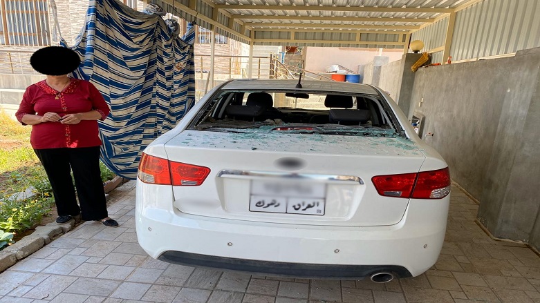 A Christian resident's rear car window shatterd as the result of the Turkish airstrike fallout inside the Bersv community, Duhok Province, June 21, 2020. (Photo: Islam Yousif /Kurdistan 24)